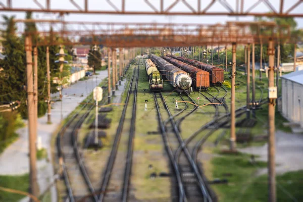 tilt shift landscape industrial railroad tracks train   summer