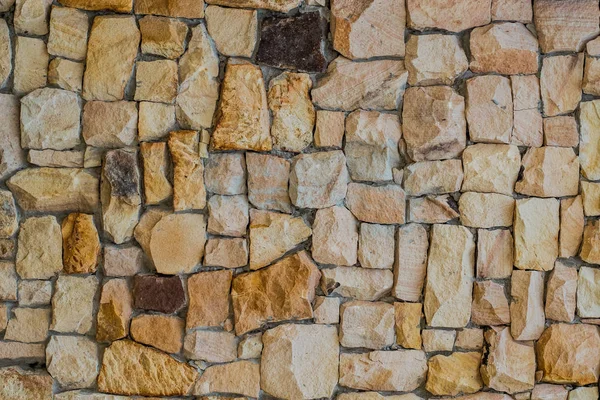 Stone wall texture background ,wall of natural texture decorative from sandstone, design backdrop