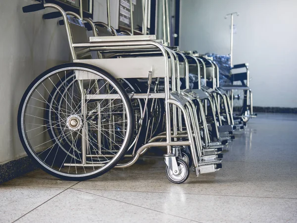 Row Wheelchairs in the hospital, Wheelchairs waiting for patient services . — стоковое фото