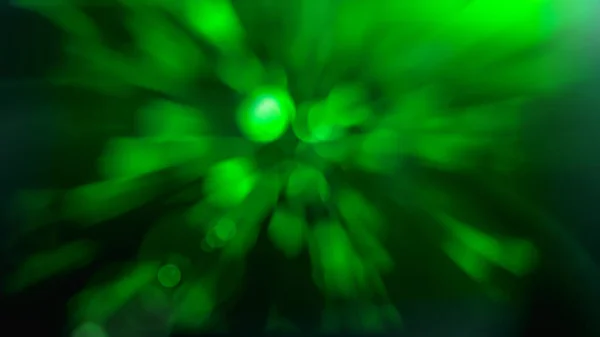 Light flare on abstract glowing light on a green background — Stock Photo, Image