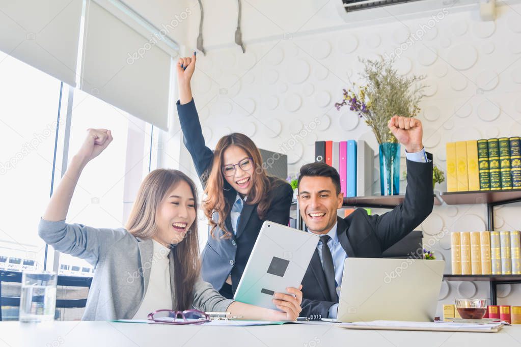 Cheering happy business people ,Happy business team with arm raised sitting in office during an office monthly meeting success, business concept background ,Activity moving blurred concept