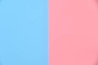 Üst görünümden soyut pastel pembe mavi renk arkaplan düz stüdyo arkaplan tasarımı yatıyordu