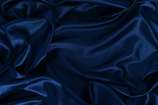 Texture Satin ripple fabric Blue cloth simple surface used us luxury backdrop products design.