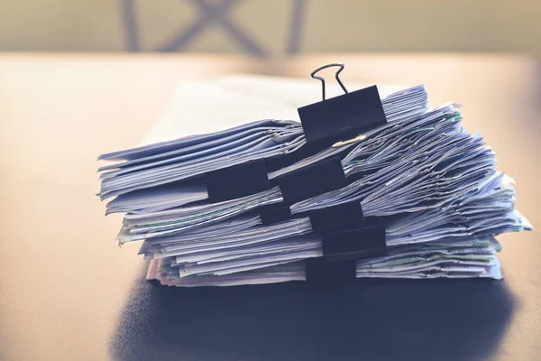 Close up document pile on office desk, stack of business paper on the table for background