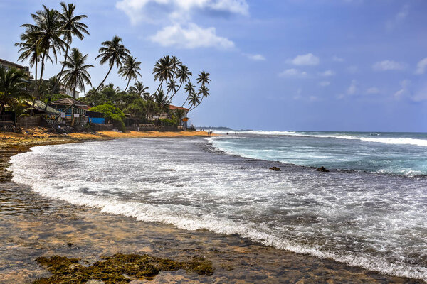 Hikkaduwa Beach and his coral reef on a sunny day, Sri Lanka