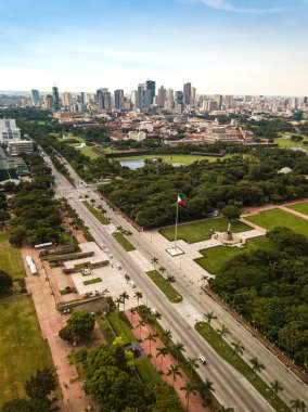 Manila, Philippines - Top to Bottom: San Nicolas and Binondo skyline, Intramuros, and Rizal Park (Luneta) clipart
