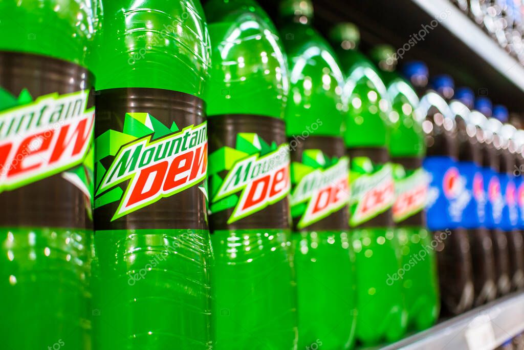 Manila, Philippines - July 2020: A row of Mountain Dew and other Pepsi products on display at an aisle in a supermarket.