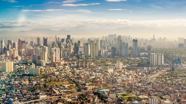 Metro Manila Skyline viewed from Airplane, as of 2020. visible in picture are Pasay, Makati, Eastwood city and mountains of Rizal. Shot in the morning, 7am