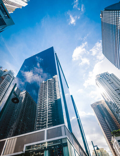 Ultra modern skyscrapers in Fort Bonifacio. Reflection of buildings on a glassy office highrise. Shot in Metro Manila, Philippines.