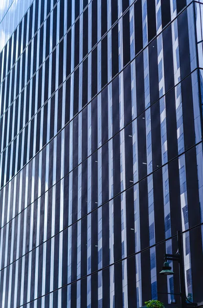 Closeup of glass cladding of an office building in Fort Bonifacio, Metro Manila.