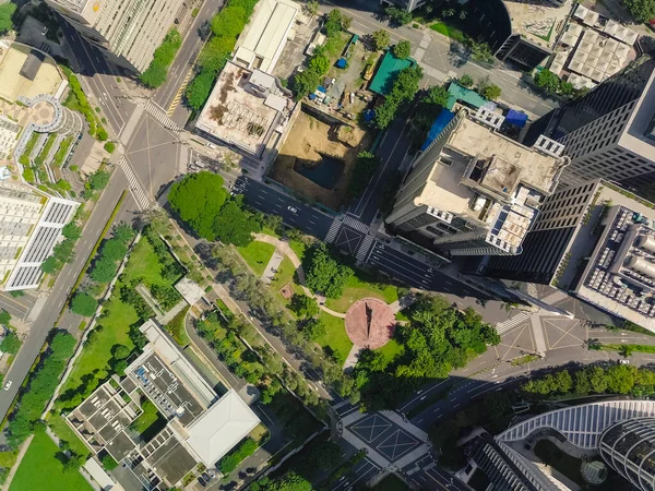 Top view of a park and buildings in Fort Bonifacio, Metro Manila. Rooftops and street layout.