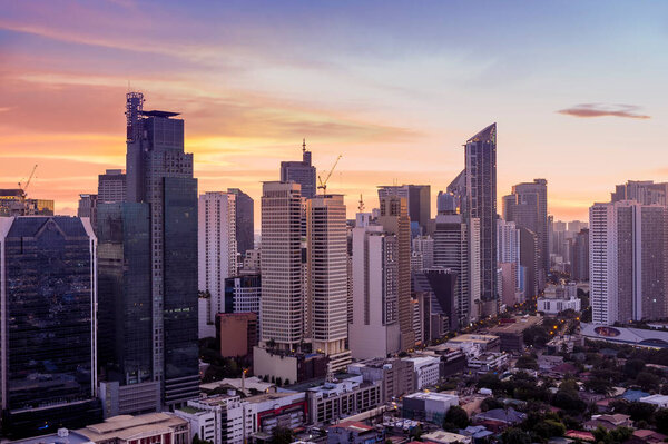 Makati, Metro Manila, Philippines - Beautiful skyline at sunset. View of Office buildings and residential area.