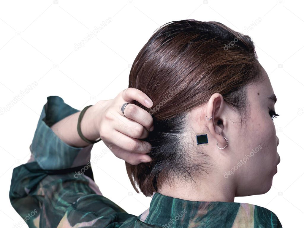 A small microchip implanted at the back of the ear of a woman. Concept of Computer enhanced human or cyborg. Isolated on white background.