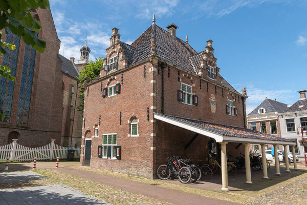 WORKUM, FRIESLAND/THE NETHERLANDS - JULY 16, 2020: The historic building Waag was (1650) is located on the market square de Merk 