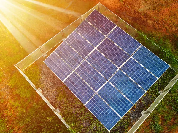 Solar panels against the sunshine, Bright Sunny Day, Solar Farm in rural, Eco-environmentally friendly green energy of sustainable development, Alternative power energy concept.