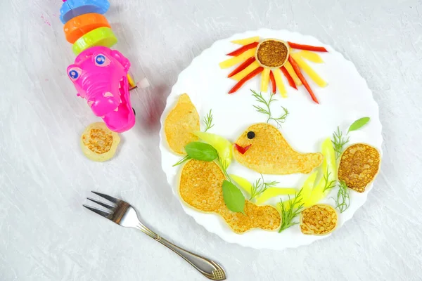 Food art creative concepts. Very cute whale or fish made of mini pancakes and vegetables and cheese