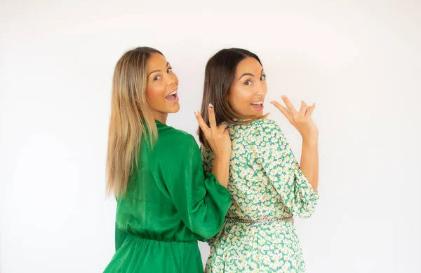 Two Friends Green Dresses Victory Gesture Smiling — Stock Photo, Image