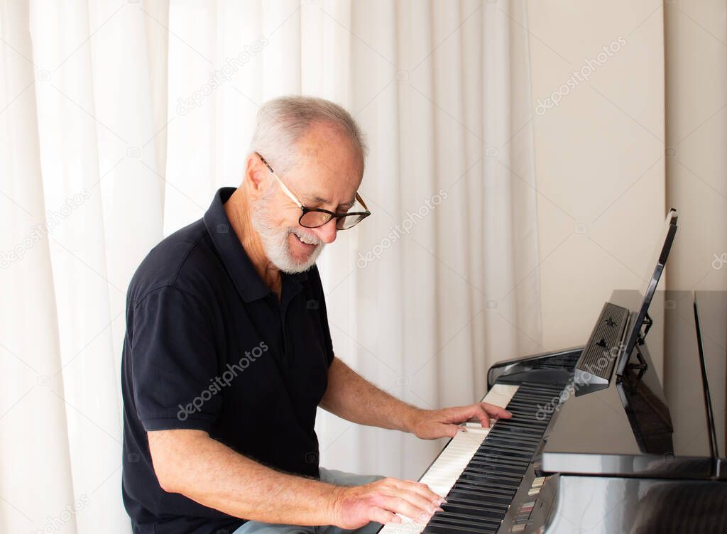 Old man play on piano. isolated against white background