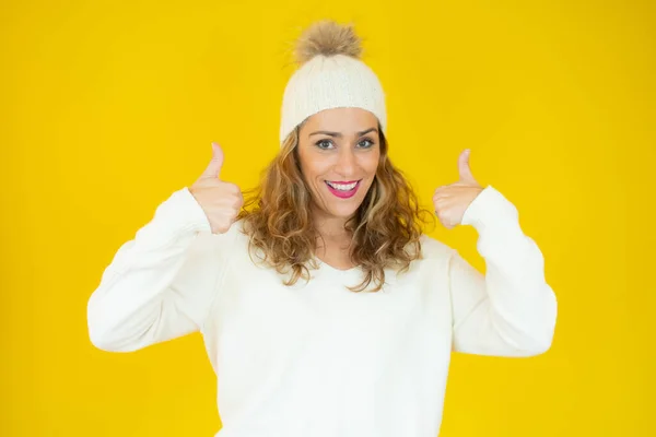 Portrait Happy Young Woman Winter Clothes Thumbs Yellow Background — Stock Photo, Image