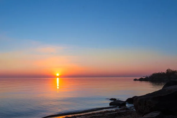 landscape on the water - sunset on the coast (horizon). top view.