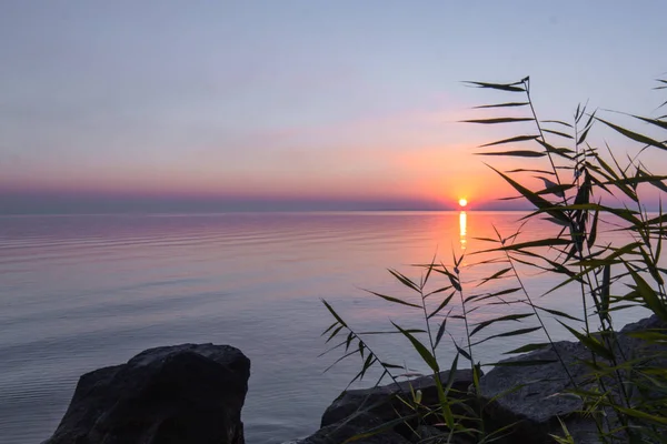 landscape on the water - sunset on the coast (horizon). top view.