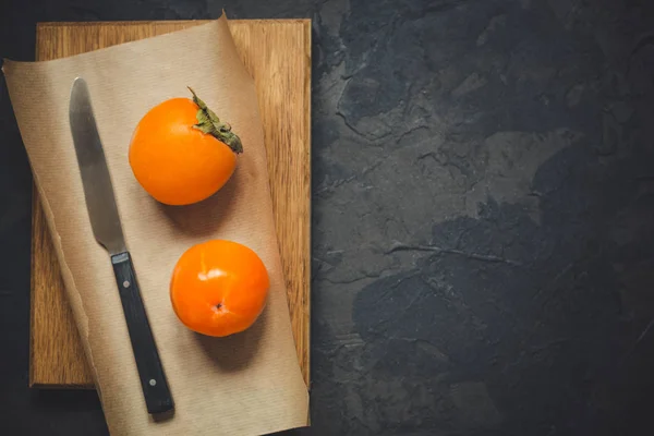Persimmonripe 오렌지 Fruiton 어두운 소박한 텍스처 — 스톡 사진