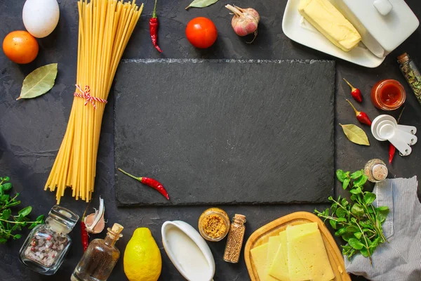 pasta, ingredients, tomato (slate on the table)