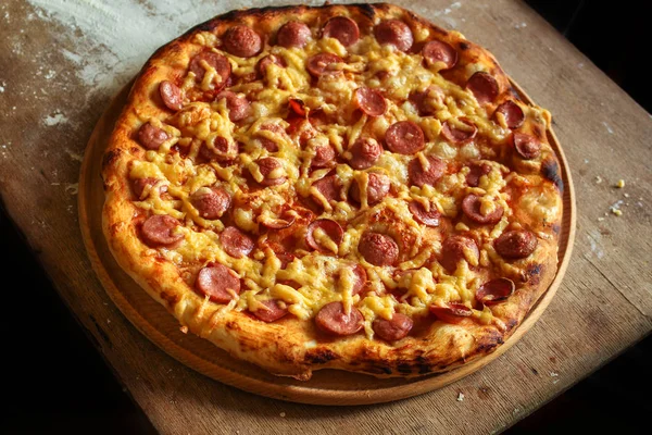 pizza sausagessalami and cheese hot and fresh (ingredients). hot pizza. Top view. copy space