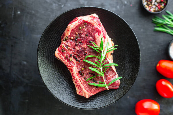 raw steak rib eye meat beef juicy on the table serving size second course top view copy space for text food background rustic