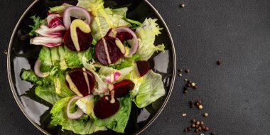 Beet salad green leaf lettuce vegetables natural product tasty snack fresh delicious gourmet food background on the table rustic top view copy space keto and paleo diet vegan and vegan food