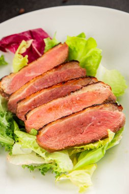 Duck breast roast poultry fresh natural product tasty snack delicious gourmet food background on the table rustic top view copy space