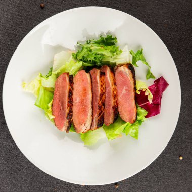 Duck breast roast poultry fresh natural product tasty snack delicious gourmet food background on the table rustic top view copy space