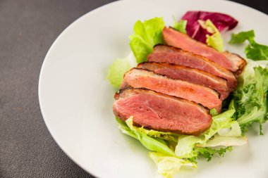 Duck breast roast poultry fresh natural product tasty snack delicious gourmet food background on the table rustic top view copy space