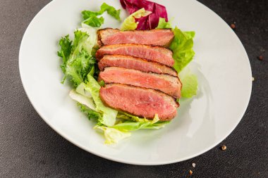 Duck breast roast poultry fresh natural product tasty snack delicious gourmet food background on the table rustic top view copy space