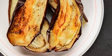 Baked eggplant grilled vegetables fresh natural product tasty snack delicious gourmet food background on the table rustic top view copy space keto and paleo diet vegan and vegan food
