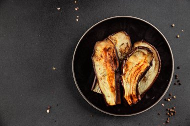 Baked eggplant grilled vegetables fresh natural product tasty snack delicious gourmet food background on the table rustic top view copy space keto and paleo diet vegan and vegan food