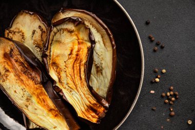 Baked eggplant grilled vegetables fresh natural product tasty snack delicious gourmet food background on the table rustic top view copy space keto and paleo diet vegan and vegan food