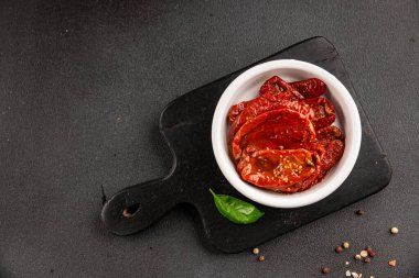 Sun-dried tomatoes snack vegetables natural product tasty snack fresh delicious gourmet food background on the table rustic top view copy space keto and paleo diet vegan and vegan food