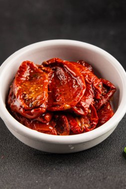 Sun-dried tomatoes snack vegetables natural product tasty snack fresh delicious gourmet food background on the table rustic top view copy space keto and paleo diet vegan and vegan food