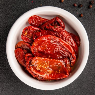 Sun-dried tomatoes snack vegetables natural product tasty snack fresh delicious gourmet food background on the table rustic top view copy space keto and paleo diet vegan and vegan food