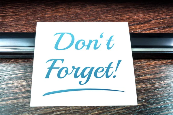 Don\'t Forget Reminder On Paper Lying On Wooden Table