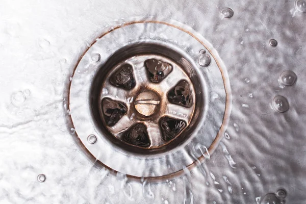 Bright Dirty Drain Of A Kitchen Sink With Flowing Water, Top Down View — Stock Photo, Image