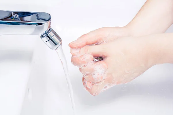 Female Soaped Hands Over A Basin Ready To Wash Under The Running Water — Stock Photo, Image