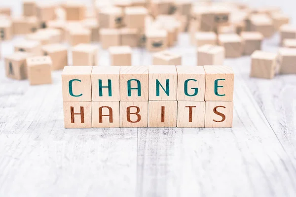 The Words Change Habits Formed By Wooden Blocks On A White Table, Reminder Concept — Stock Photo, Image