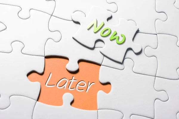 The Words Now And Later In Missing Piece Jigsaw Puzzle — Stock Photo, Image