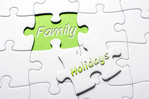 The Words Holidays And Family In Missing Piece Jigsaw Puzzle — Stock Photo, Image