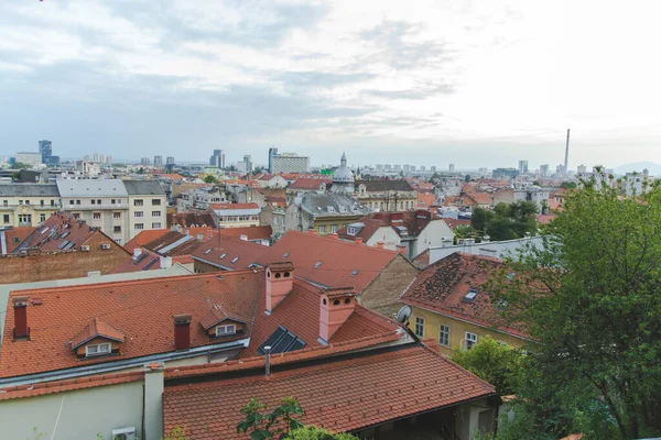 Cityscape of Zagreb city with orange brown roofs. Urban landscape of the old capital in Croatia. Panorama view of city, as travel concept.