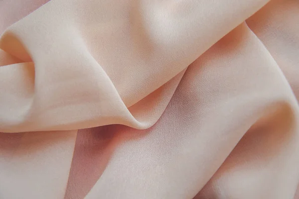 Tecido com pegas onduladas na cor rosa pêssego — Fotografia de Stock