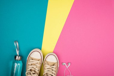 Bright multi-colored trend background and sneakers. Creative background for your project. 80, pink, blue, yellow, clipart