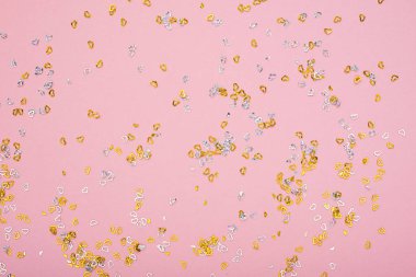 Parıldıyor, konfeti ve glitter ile evrensel Festival arka plan pembe altın. Yatay, kopya alanı. Herhangi bir proje için kavramı,